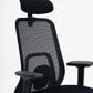 Close-up of breathable mesh backrest on black office chair