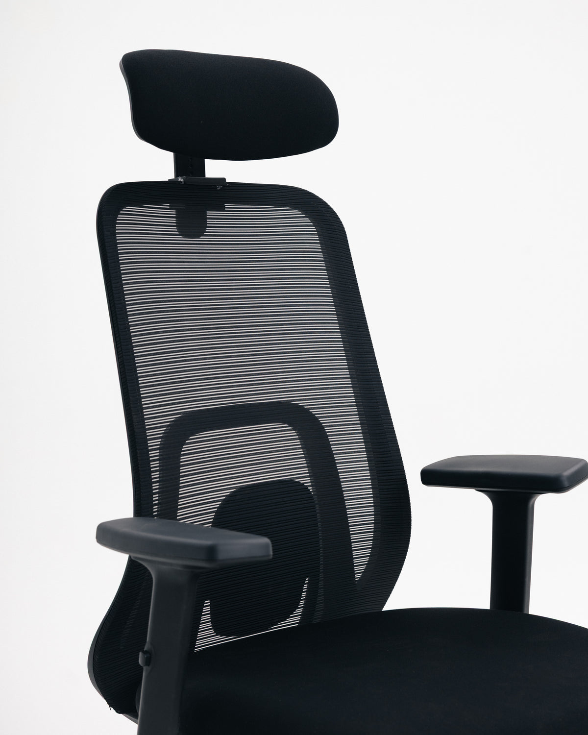Close-up of breathable mesh backrest on black office chair